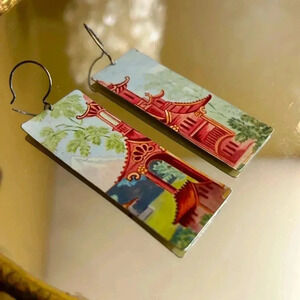 One of a kind of earrings made from a decorative tin by an artist in Oklahoma